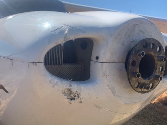 Propeller flange and nose cowl damage 