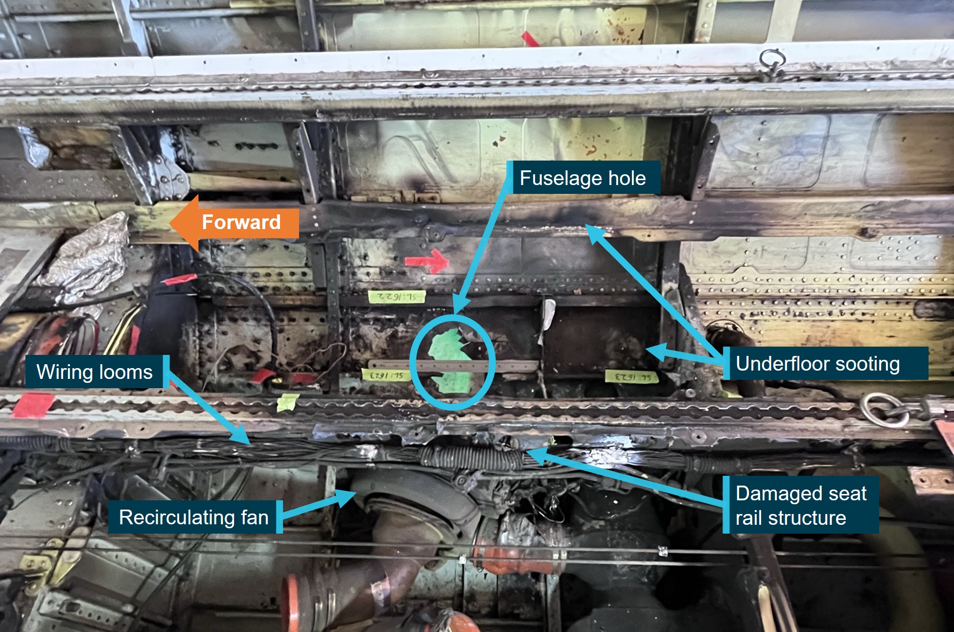 Underfloor fire damage showing fuselage hole