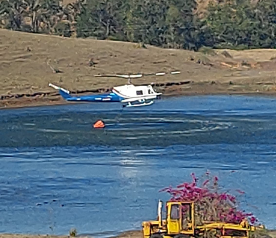 Figure 2: VH-EQW picking up water from the dam just prior the accident