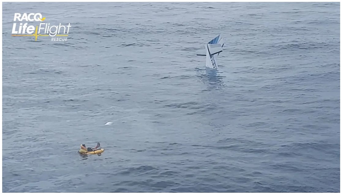 Figure 2: VH-VPY remained partially afloat after the ditching and the pilots are nearby using the inflated life raft