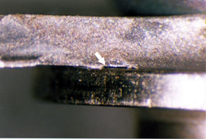 Figure 6. Second-stage NGV housing with a large puncture and cracking from the released turbine blade.