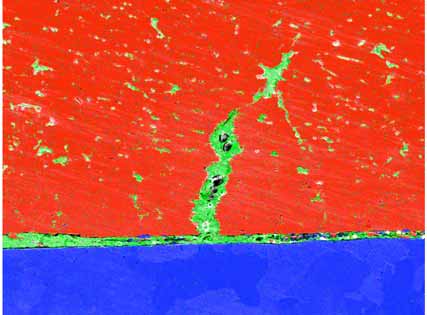 Figure 11. SEM X-ray map confirming the lead migration (green phase) within the copper alloy (red phase) and at the steel (blue phase) interface