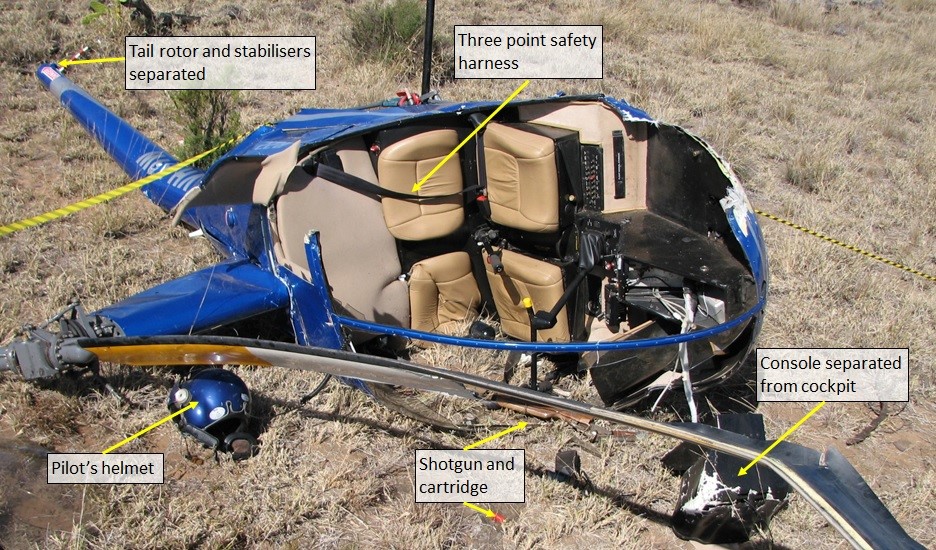 Figure 4: Helicopter wreckage, showing the ejected instrument console, damaged main rotor blade and destroyed canopy