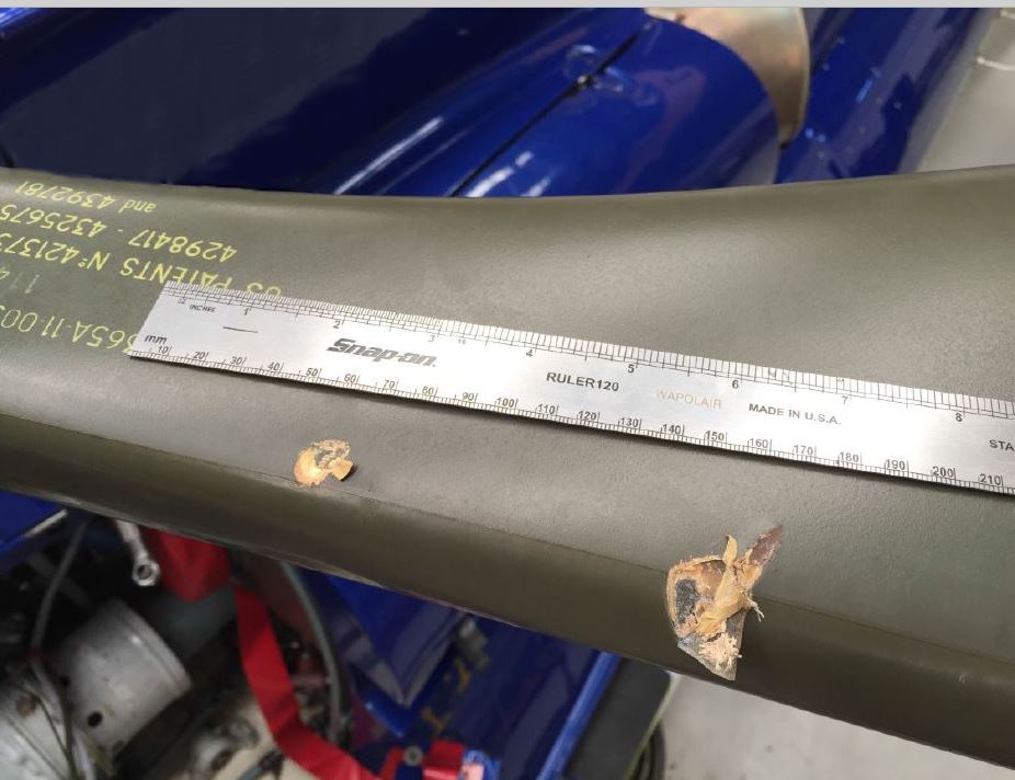 Figure 1: Damage to leading edge of a main rotor blade on VH-WPX