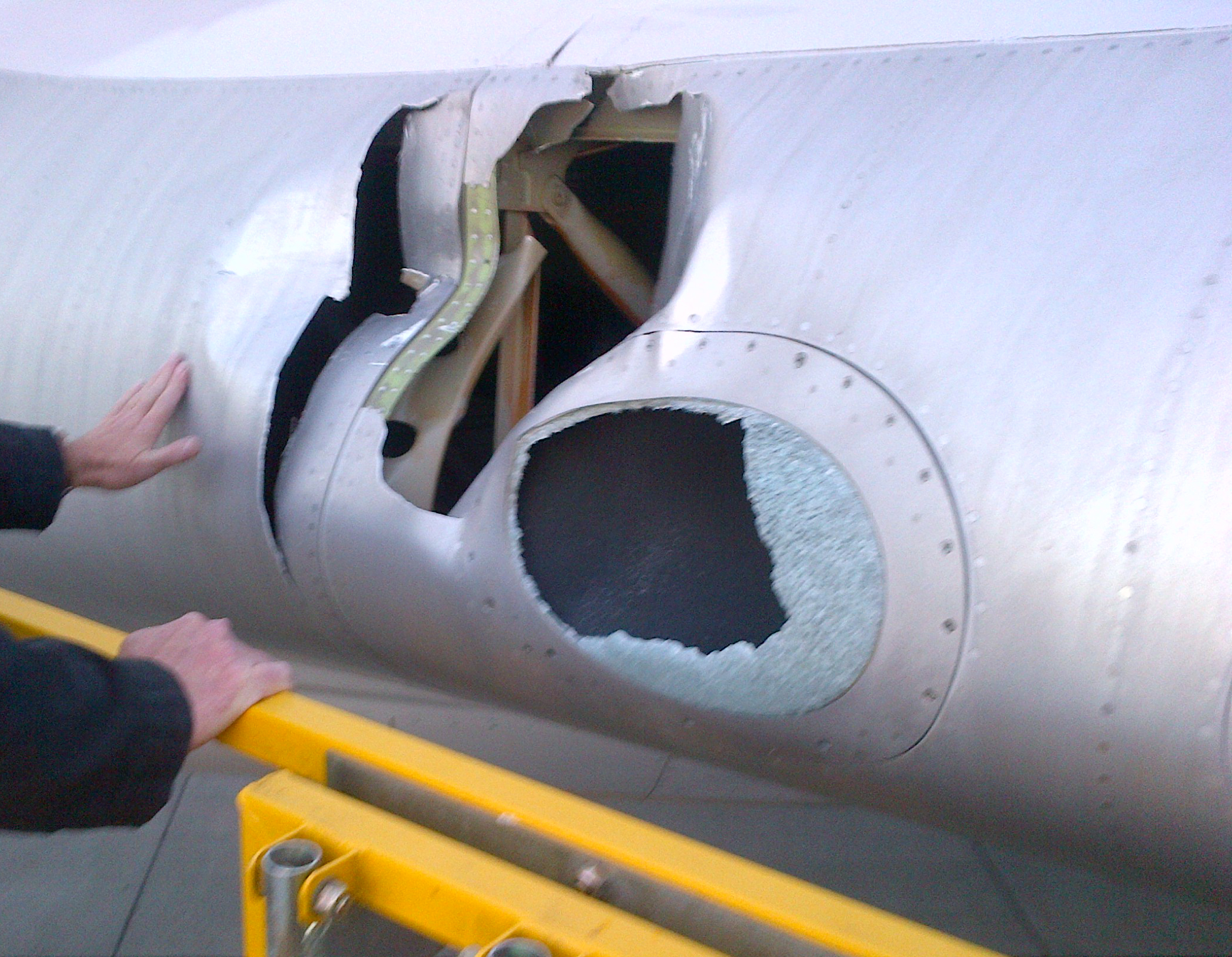 Figure 4: Close up of the damage to the left wing inboard leading edge and landing light cover