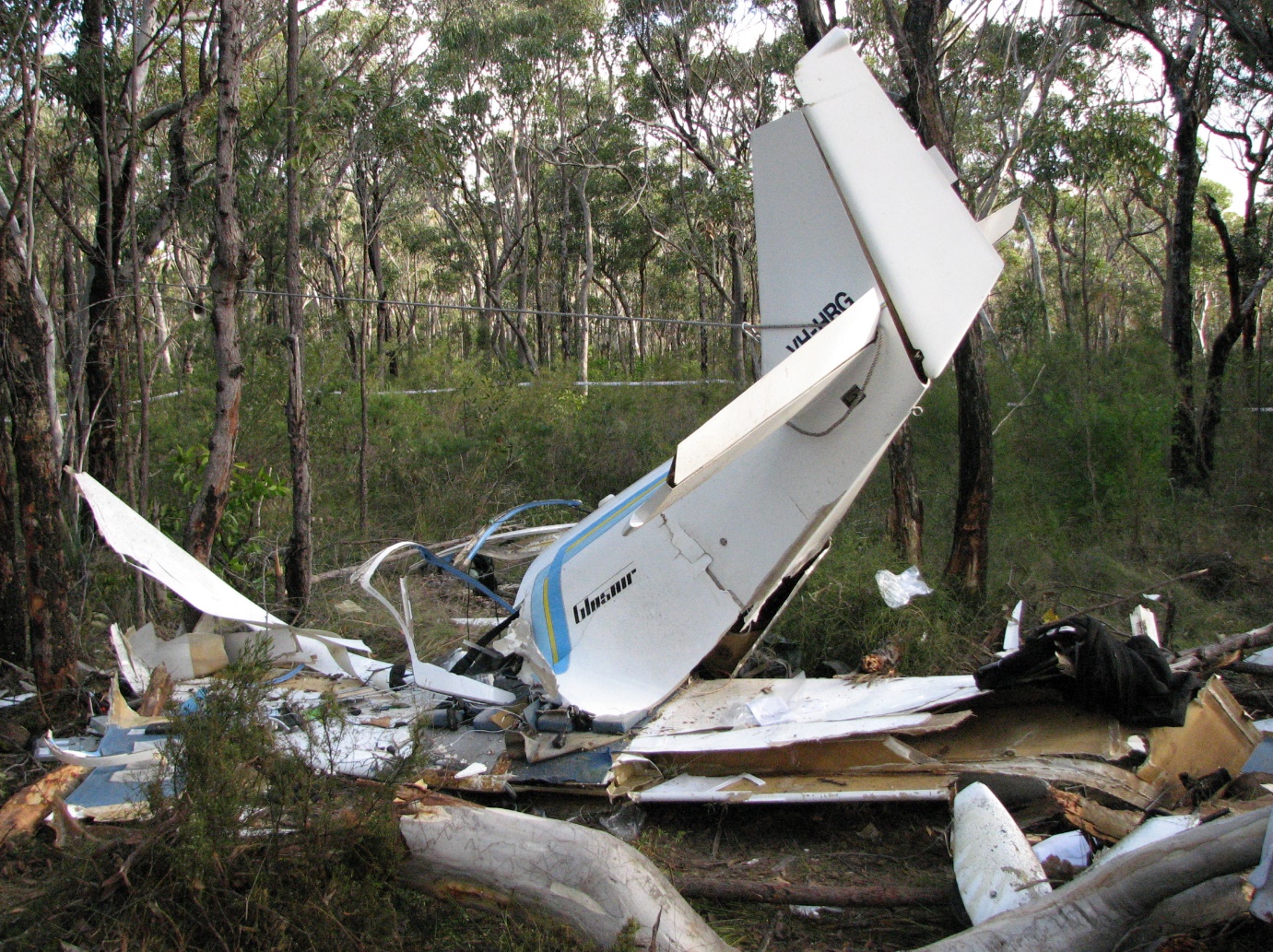 Figure 2: Aircraft wreckage. Note that the tail empennage is secured in an elevated position by being tied off to a nearby tree