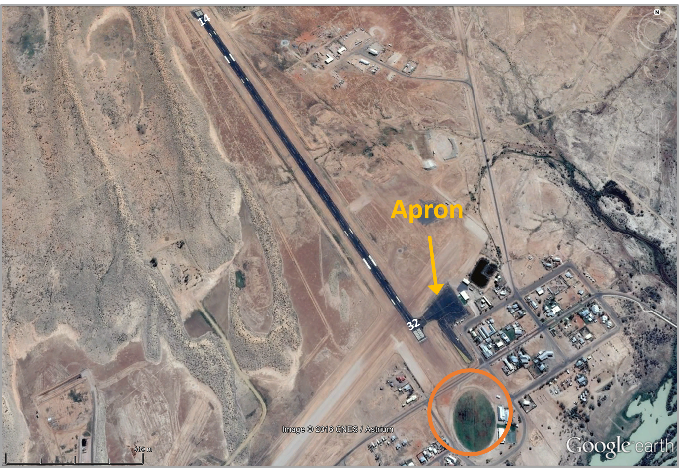 Figure 1: Birdsville airport showing the location of runway 32, the parking apron and where the birds (hawks) were generally located off the end of runway 32 (orange circle).