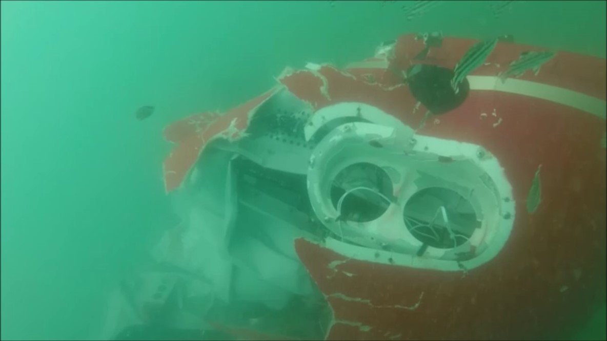 Figure 2: Underwater image of VH-YLY showing significant damage to the nose and belly panel of the helicopter particularly to the right forward section and loss of the cockpit upper portion