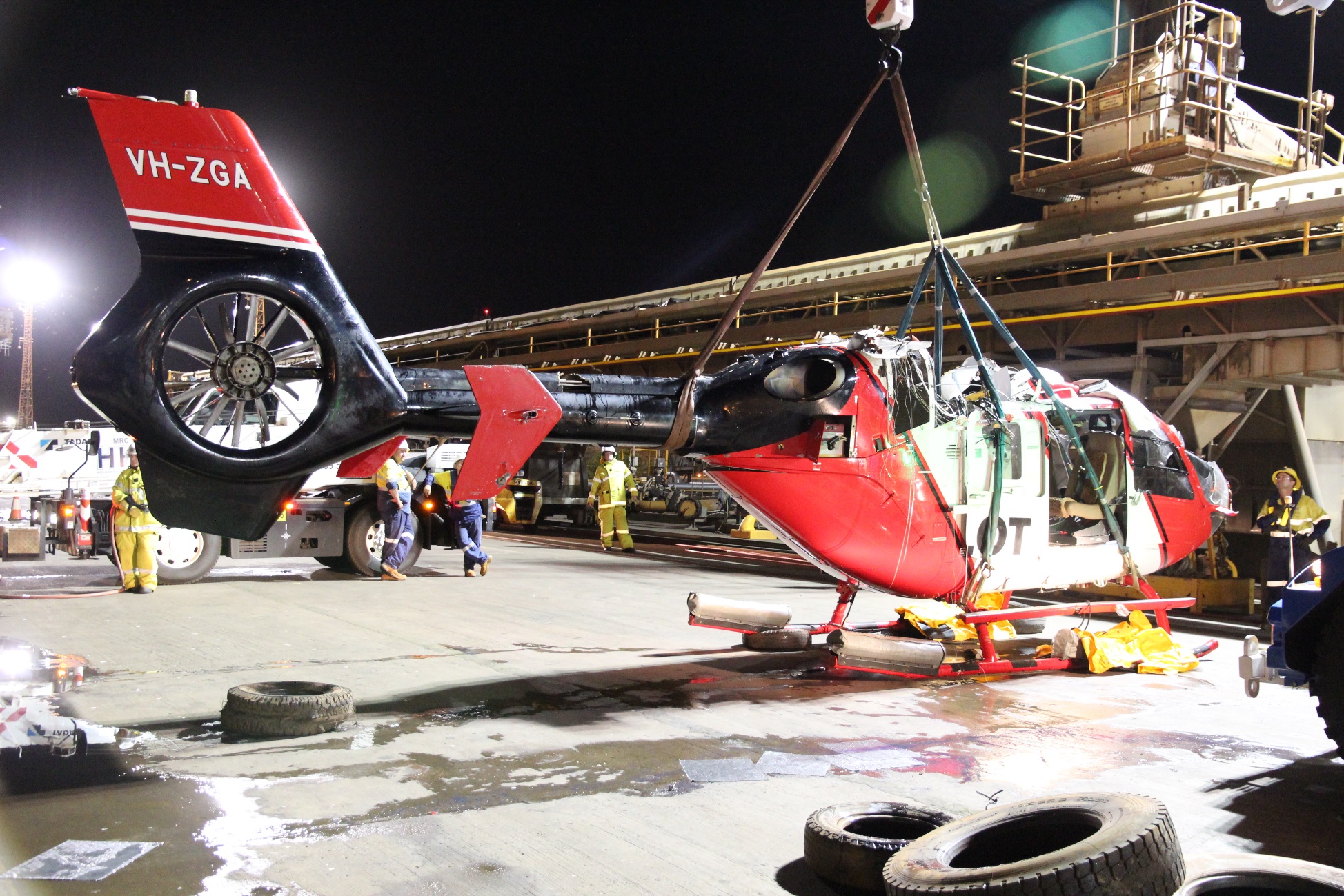 Figure 6: Helicopter wreckage being lifted onto the dock. Source: ATSB.