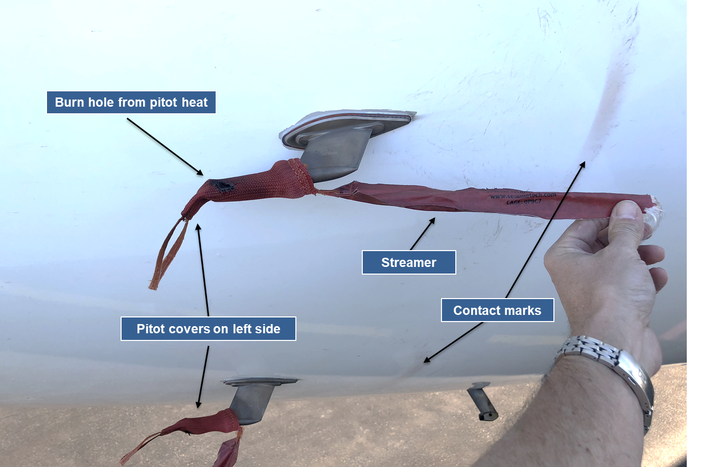 Reconstruction of pitot probe covers on 9M-MTK, showing pitot cover damage and rub marks on aircraft skin from the streamer (Source: ATSB)