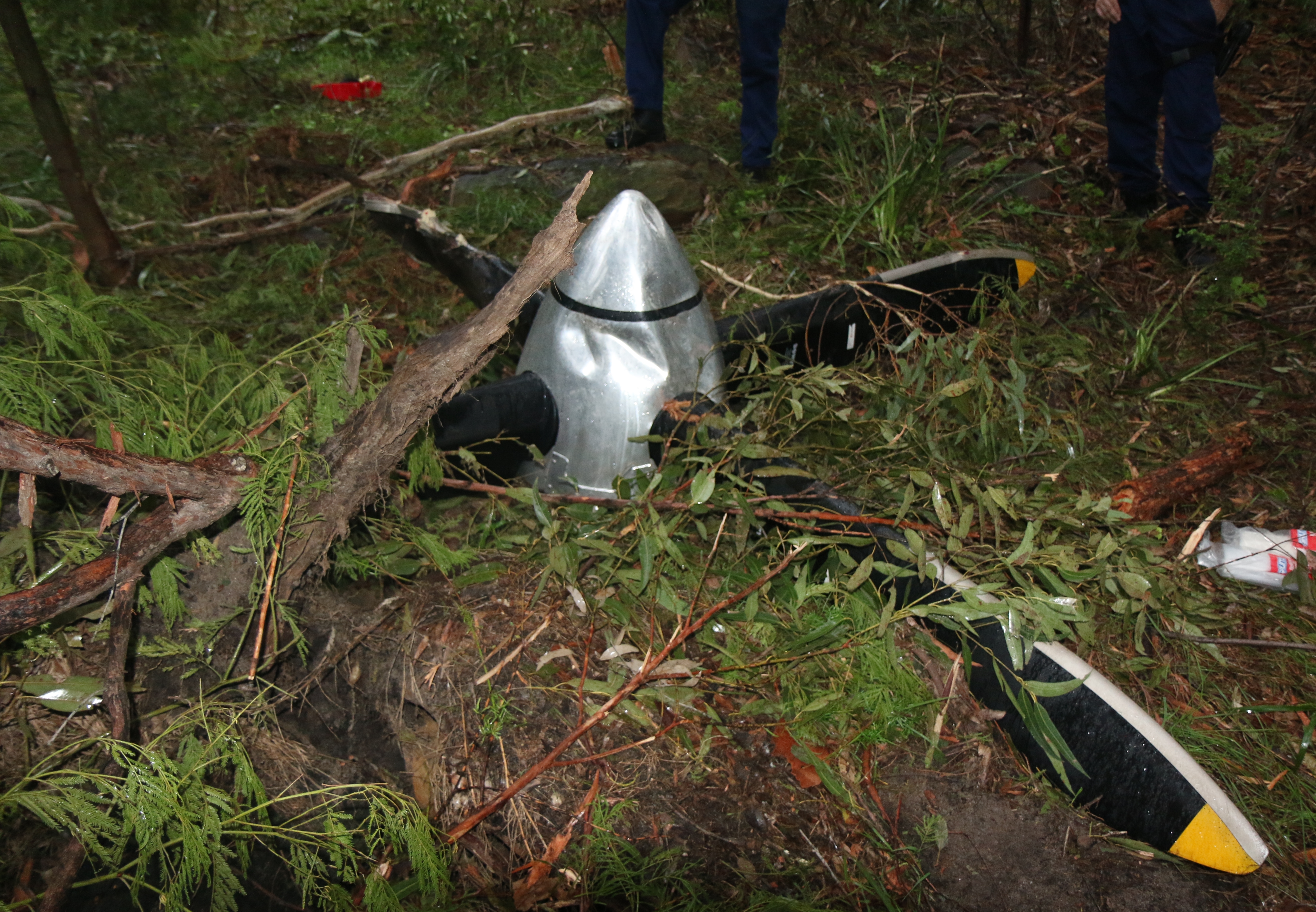 Figure 2a: The separated propeller from VH-NRX. The image on the left shows the propeller as found in bushland by PolAir about 10 NM south-west of Sydney airport The image on the right shows the propeller flange still attached to the rear of the propeller. Note that the attachment nuts were in the process of being removed by ATSB investigators onsite, in order to release the flange. Source: ATSB