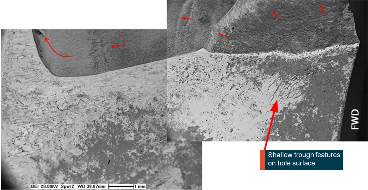 Figure 8: Scanning electron microscope image of the internal surface of the dowel pin hole and initial fracture surface. Source: GE