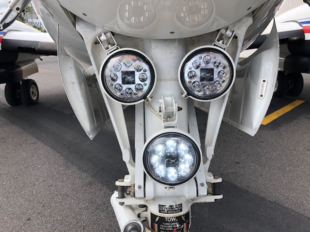 Figure 4: RFDS Beech B200 landing and taxi lights. The nose gear of a RFDS Beech B200 fitted with LED lights for landing (outer) and taxi (centre). Source: Royal Flying Doctors Service