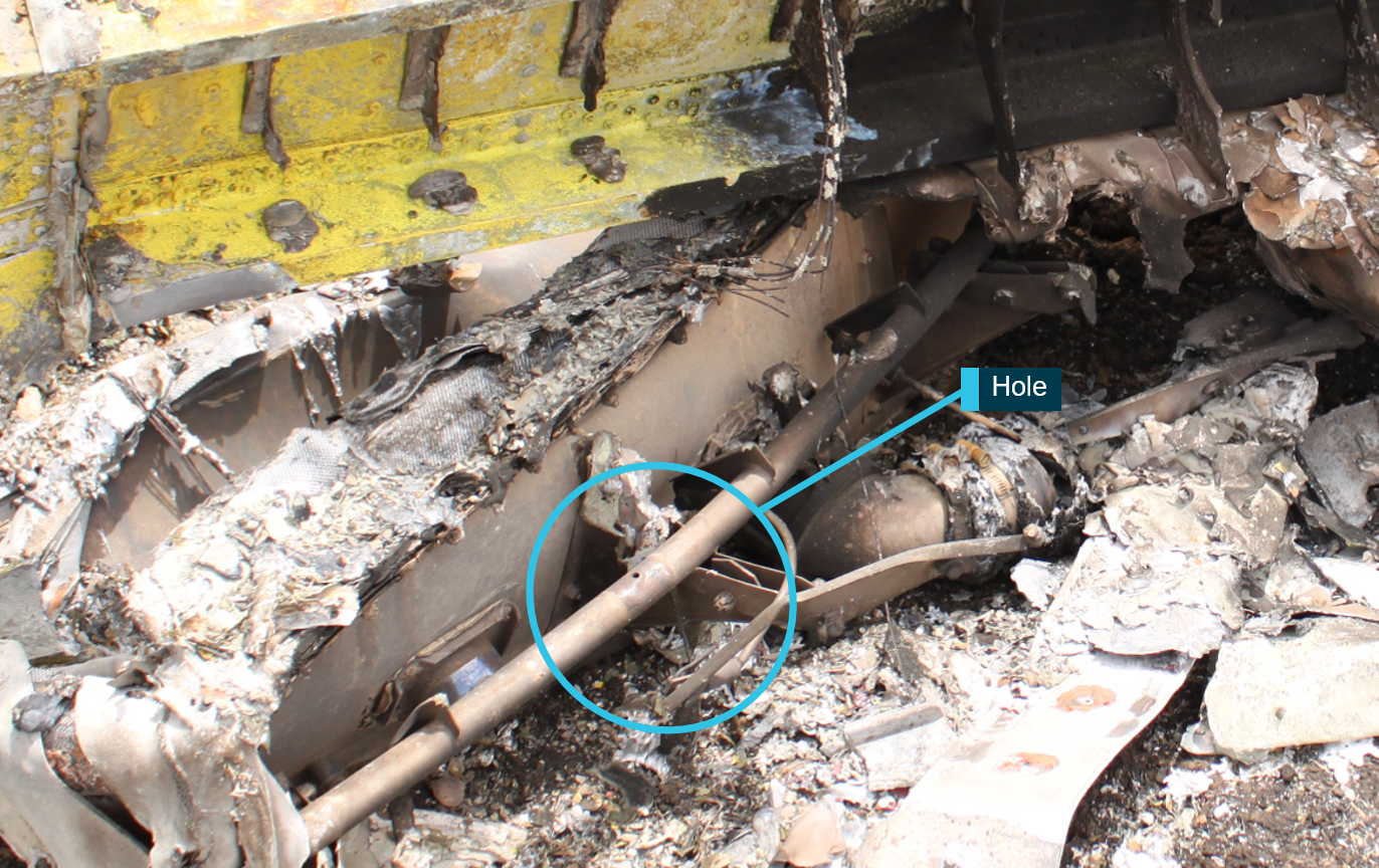 Figure 10: Gate box wreckage showing hole in gate box torque tube where bolt was missing. Source: ATSB