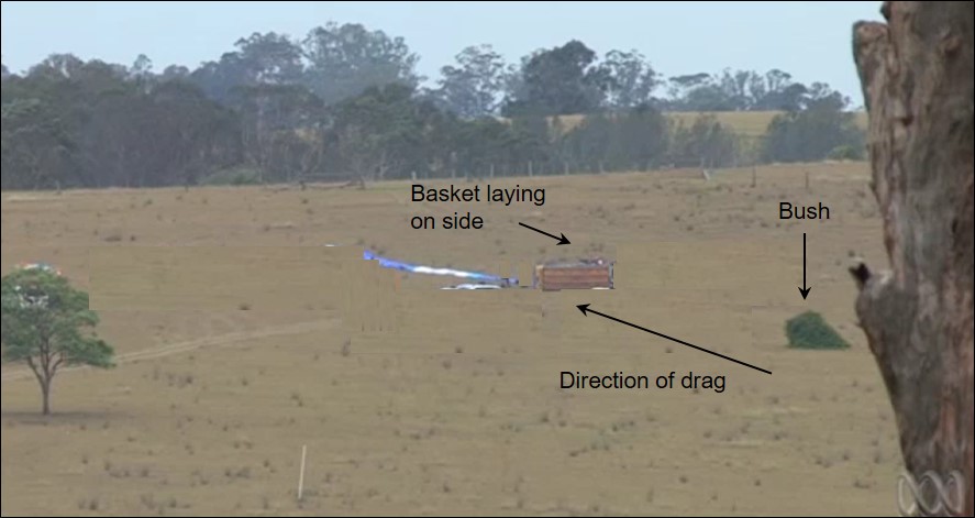 Figure 2: Landing site terrain with the deflated balloon, basket and the bush it contacted. Source: Australian Broadcasting Corporation with annotation by ATSB