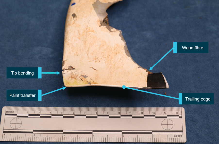 Figure 9: Tail rotor blade tip. Tail rotor blade 2 tip cap with yellow paint transfer from the main rotor and bending deformation.<br />
Source: ATSB