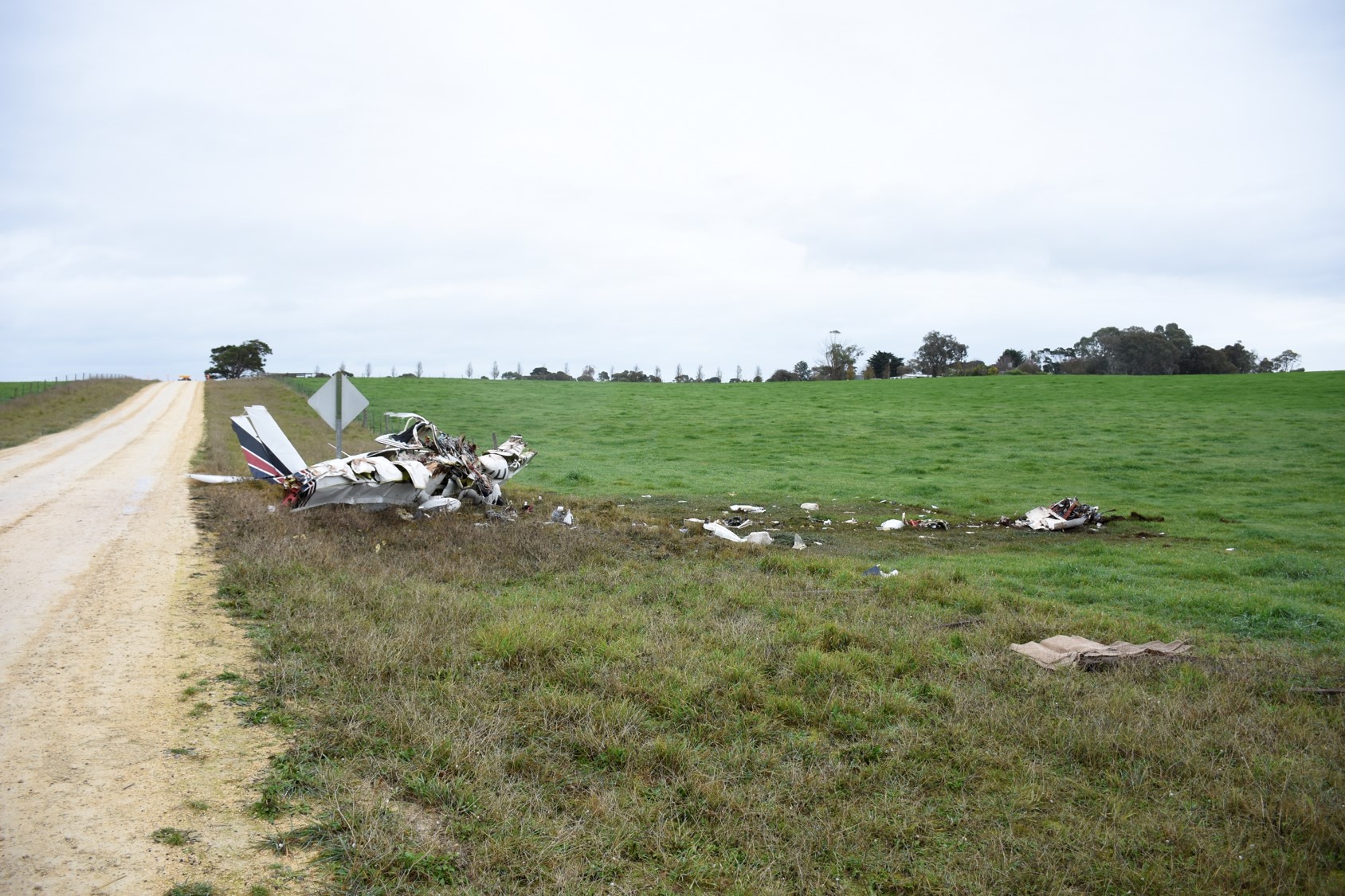 Accident site, showing the engine and propeller location, the left and right wing impact marks and the main wreckage