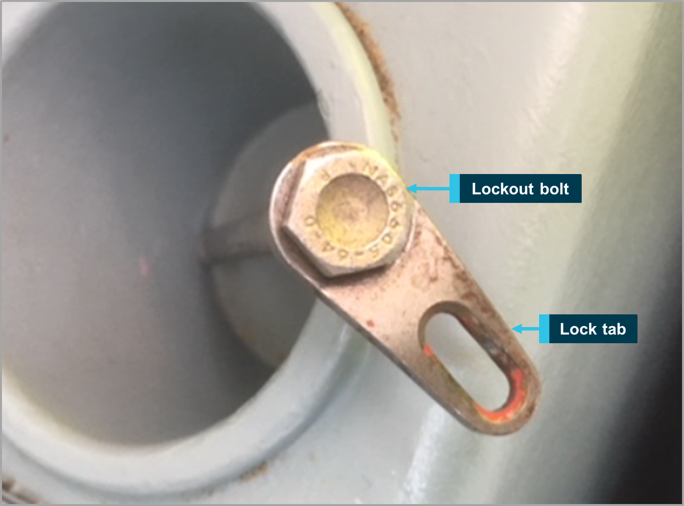 Figure 1: In-service thrust reverser lockout bolt and lock tab. Source: Operator, annotated by ATSB.