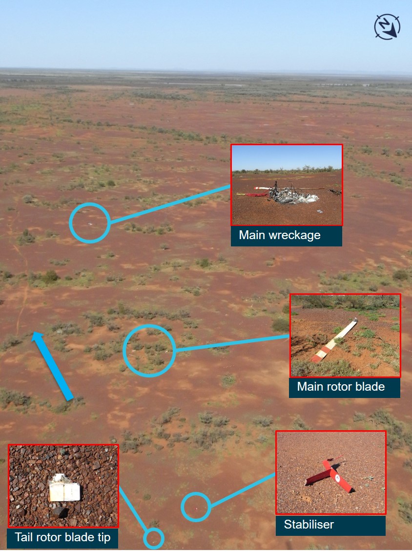 Figure 2: Wreckage distribution showing main body and tail rotor stabiliser assembly, the blue arrow shows direction of travel.<br />
Source:  ATSB