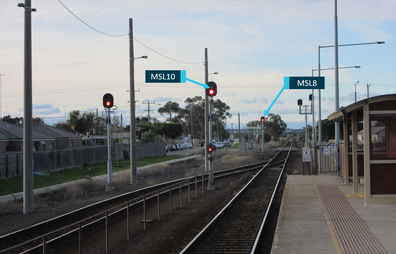 Figure 4: Signals MSL10 and MSL8 at Marshall, pictured displaying ‘Stop’ indications. The picture shows signal MSL10 adjacent to the Geelong-end of Marshall Railway Station. Signal MSL8 is identified in the distance, closer to the Marshalltown Road level crossing.