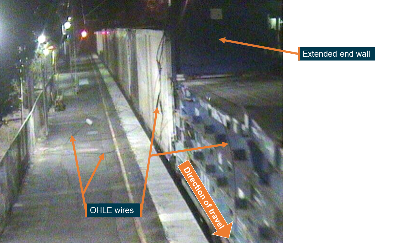 Figure 4: CCTV footage at Cooroy station showing the flat racks with the extended end wall and OHLE wires that had been brought down.<br />
Source: Queensland Rail