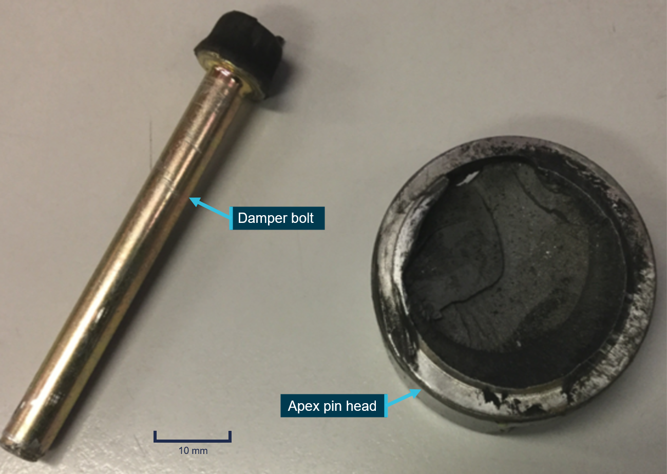 Figure 4: A damper bolt and head of apex pin retrieved from runway 34R