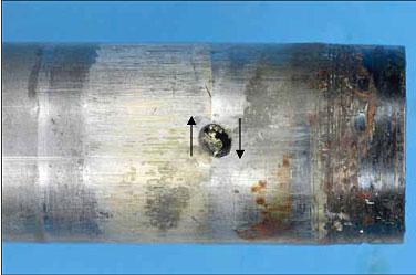 Figure 7: Torsional distortion of the drive shaft adjacent to the point of failure. Note the elongation of the small hole