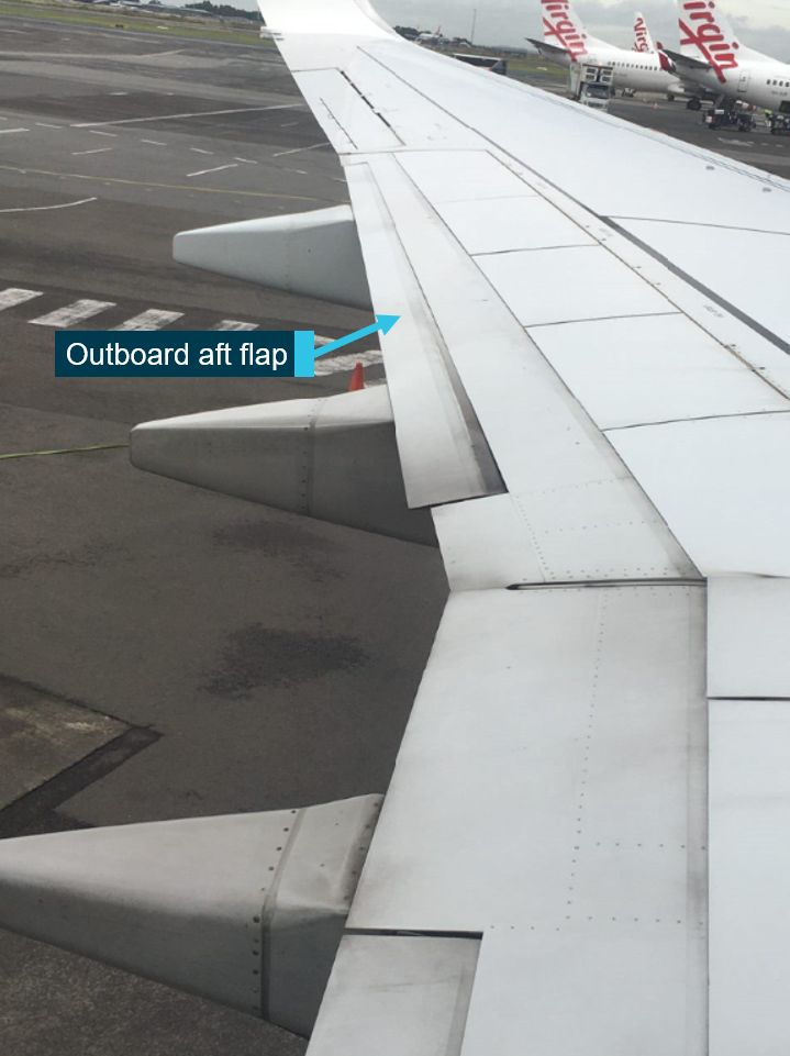 The skewed left outboard aft flap of VH-YFZ after landing in Sydney