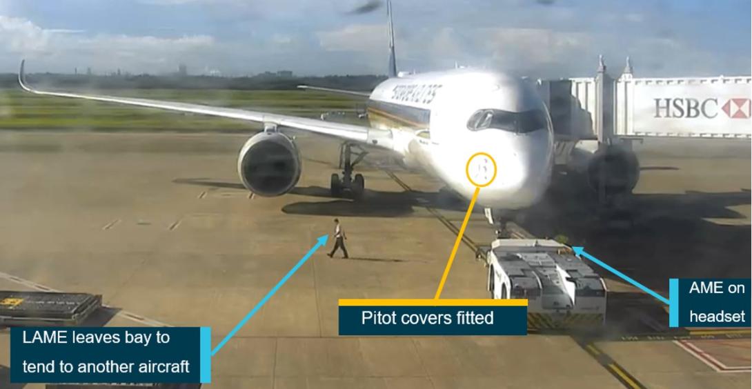 Figure 1: Security footage of bay 81 showing SQ256 4 minutes before pushback with the pitot covers fitted and the LAME moving towards the adjacent bay