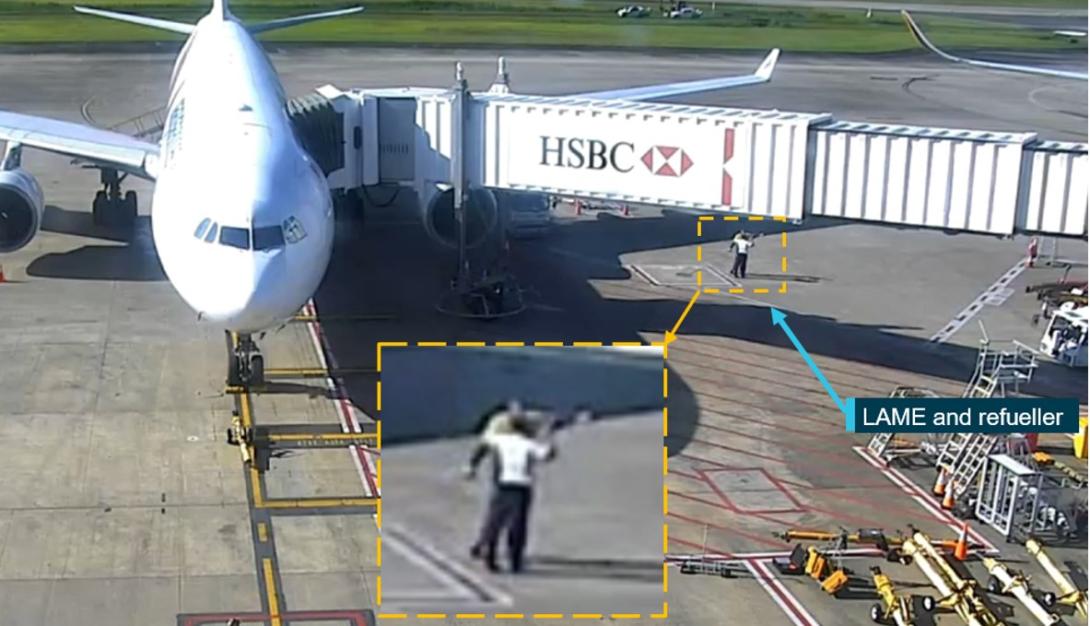 Figure 2: Security footage of the refueller pointing towards SQ256 and informing the LAME that the pitot covers were fitted