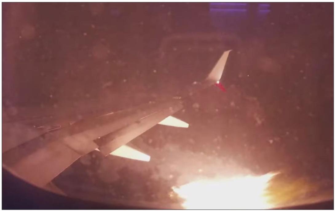 Figure 1: Photograph of fire emanating from engine of Boeing 737-8FE aircraft