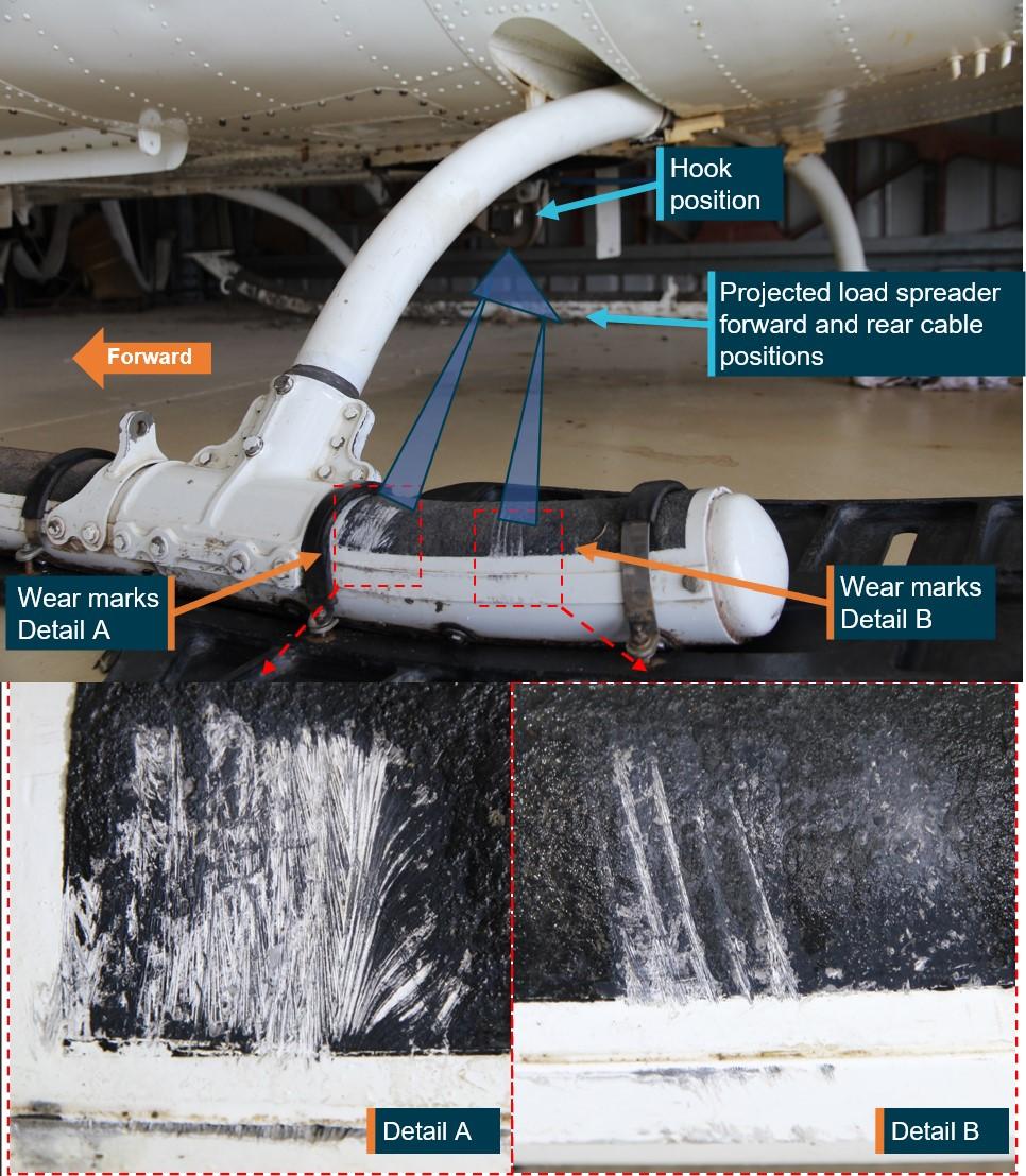 Figure 9: Outboard of left rear skid showing hook position and likely position of spreader with forward and rear cables aligned with wear damage