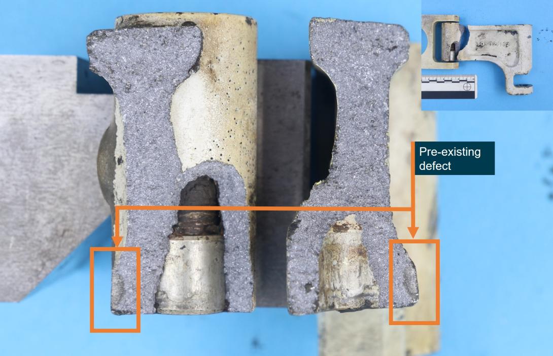 Figure 6: A semi-circular pre-existing defect (labelled) was identified on both halves of the steering link fracture surface 