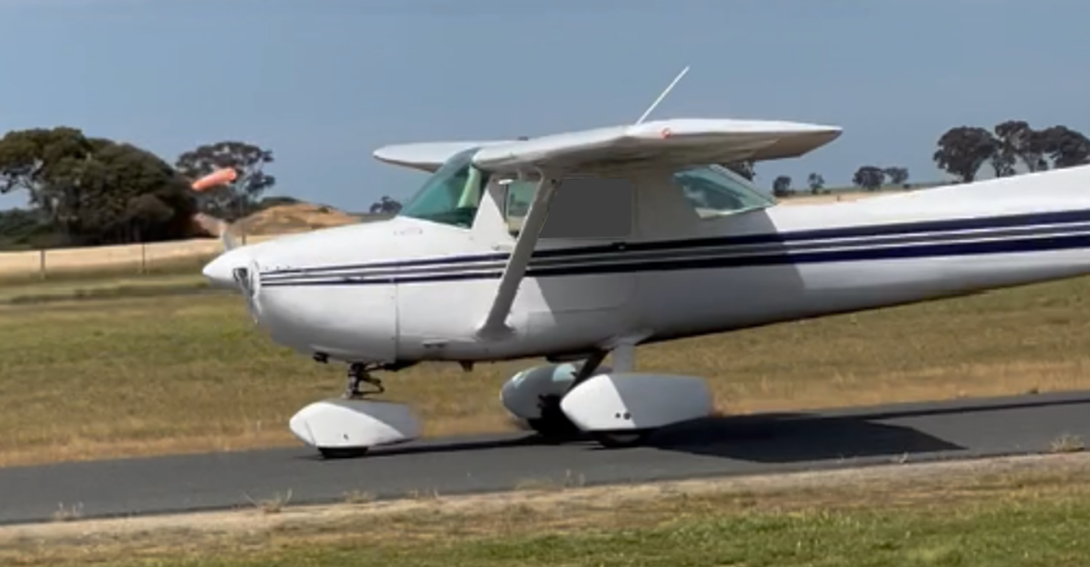VH-EYU taxiing prior to second take-off with the gliding club windsock in the background showing the strong winds at the time.